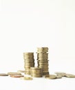 Mixed coin stacks on a white background