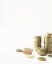 Mixed coin stacks on a white background