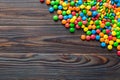 Mixed collection of colorful candy, on colored background. Flat lay, top view. frame of colorful chocolate coated candy Royalty Free Stock Photo