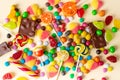 Mixed collection of colorful candy, on pink background. Royalty Free Stock Photo