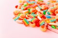 Mixed collection of colorful candy, on pink background. Close up Royalty Free Stock Photo