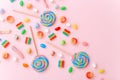 Mixed collection of colorful candy, on pink background. Flat lay, top view Royalty Free Stock Photo