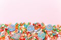 Mixed collection of colorful candy, on pink background. Flat lay, top view Royalty Free Stock Photo