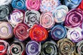 Mixed colored wool scarfs displayed for sale at a traditional store in Edinburgh, United Kingdom, top view or flat lay of a colour Royalty Free Stock Photo