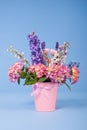 Mixed colorful bouquet on blue background