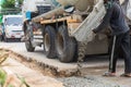 Mixed concrete pouring at construction site. Pouring cement during sidewalk upgrade. Royalty Free Stock Photo