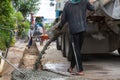 Mixed concrete pouring at construction site. Pouring cement during sidewalk upgrade. Royalty Free Stock Photo