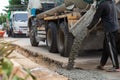 Mixed concrete pouring at construction site. Pouring cement during sidewalk upgrade. Royalty Free Stock Photo