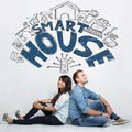 Mixed couple imaginating about smart house system, ilustrated th Royalty Free Stock Photo