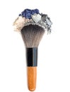 Mixed crushed make up eyeshadow with brush. Isolate on white