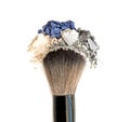 Mixed crushed make up eyeshadowr with brush. Isolate on white