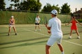 Mixed doubles tennis training, outdoor court