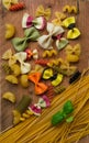 Mixed dried colored pasta selection with basil,Italian food