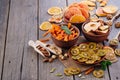 Mixed dried fruit chips, candied pumpkin slices, nuts and seeds with copy space Royalty Free Stock Photo