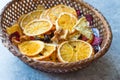 Mixed Dried Fruits Orange, Strawberry, Pineapple, Cherry and Apple Slices with Cinnamon Powder in Wooden Basket Royalty Free Stock Photo