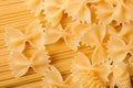 Mixed dried pasta selection on black wooden background