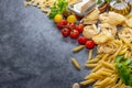 Mixed dried pasta selection on wooden background. composition of healthy food ingredients Royalty Free Stock Photo