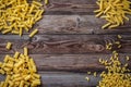 Mixed dried pasta selection on wooden background. Royalty Free Stock Photo