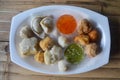 Mixed fish dumplings, fish ball on dish with sauce Royalty Free Stock Photo
