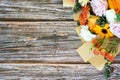Mixed flower bouquet on top of wood background