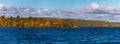 Mixed forest with colorful foliage on the Imandra lake. Autumn landscape, Kola Peninsula, Russia