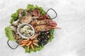 Mixed fresh seafood gourmet platter on spanish restaurant table