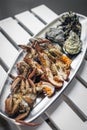 Mixed fresh seafood selection gourmet set platter meal on table