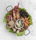 Mixed fresh seafood gourmet platter on spanish restaurant table