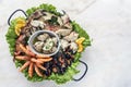 Mixed fresh seafood selection gourmet set platter meal on table