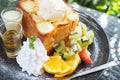 Mixed fruit and Honey toast with Ice cream in black dish on table Royalty Free Stock Photo