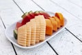 Fruit plate on white wooden table Royalty Free Stock Photo