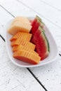 Fruit plate on white wooden table Royalty Free Stock Photo