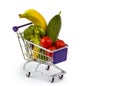 Mixed fruit and vegetables in a mini shopping cart, isolated on Royalty Free Stock Photo