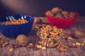 Mixed fruits and nuts in collored bowls