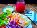 Mixed green salad with a hard-boiled egg and beetroot juice Royalty Free Stock Photo