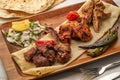 Mixed Grill served in a dish isolated on grey background side view of fastfood Royalty Free Stock Photo