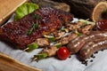 Mixed grilled meat platter. Assorted delicious grilled meat with vegetable. Royalty Free Stock Photo