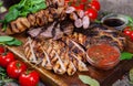 Mixed grilled meat platter. Assorted delicious grilled meat with vegetable. Royalty Free Stock Photo