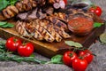 Mixed grilled meat platter. Assorted delicious grilled meat with vegetable. Royalty Free Stock Photo