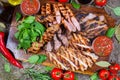 Mixed grilled meat platter. Assorted delicious grilled meat with vegetable. Royalty Free Stock Photo