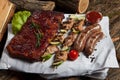 Mixed grilled meat platter. Assorted delicious grilled meat with vegetable. Royalty Free Stock Photo