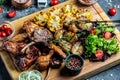 Mixed grilled meat platter. Barbecue menu. Grilled meat and vegetables. Food recipe background. Close up Royalty Free Stock Photo