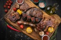 Mixed grilled meat platter on a black background Royalty Free Stock Photo