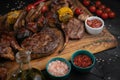 Mixed grilled meat platter on a black background Royalty Free Stock Photo