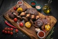 Mixed grilled meat platter on a black background Royalty Free Stock Photo