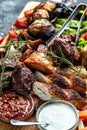 Mixed grilled meat platter. Grilled meat and vegetables. vertical image. top view Royalty Free Stock Photo