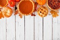 Mixed homemade autumn pies. Pumpkin, apple and pecan. Top border on a white wood background. Royalty Free Stock Photo