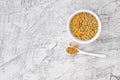 Mixed lentils in white plate on white stone background. Vegetarian super food. Top view with copy space. Flat lay Royalty Free Stock Photo