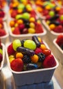 Mixed many type of fruits and berries in the paper box at the marketplace or superstore. Fruit salad in takeaway cup Royalty Free Stock Photo