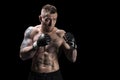 Mixed martial artist posing on a black background. Concept of mma, ufc, thai boxing, classic boxing